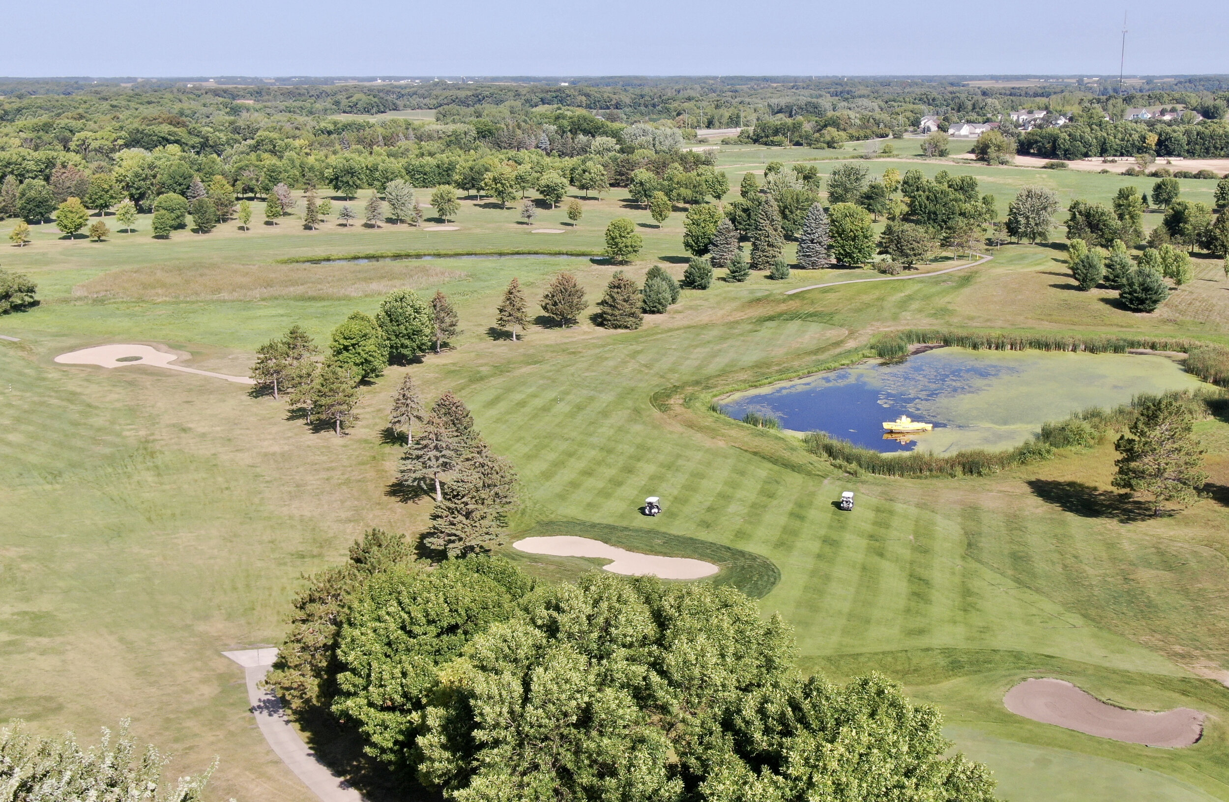 Aerial view of the 18th hole at Montgomery National, with bunkers and the pond where the yellow submarine sits